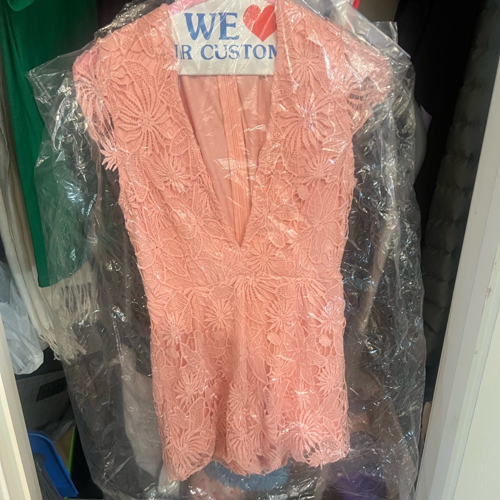 Pink lace floral romper from Impressions Boutique. Size S. Zip back